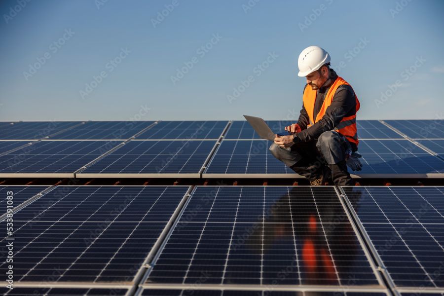 Technician working with solar panels.